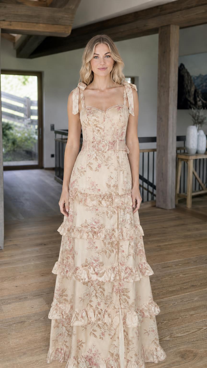 Model wearing beige floral print tiered maxi dress