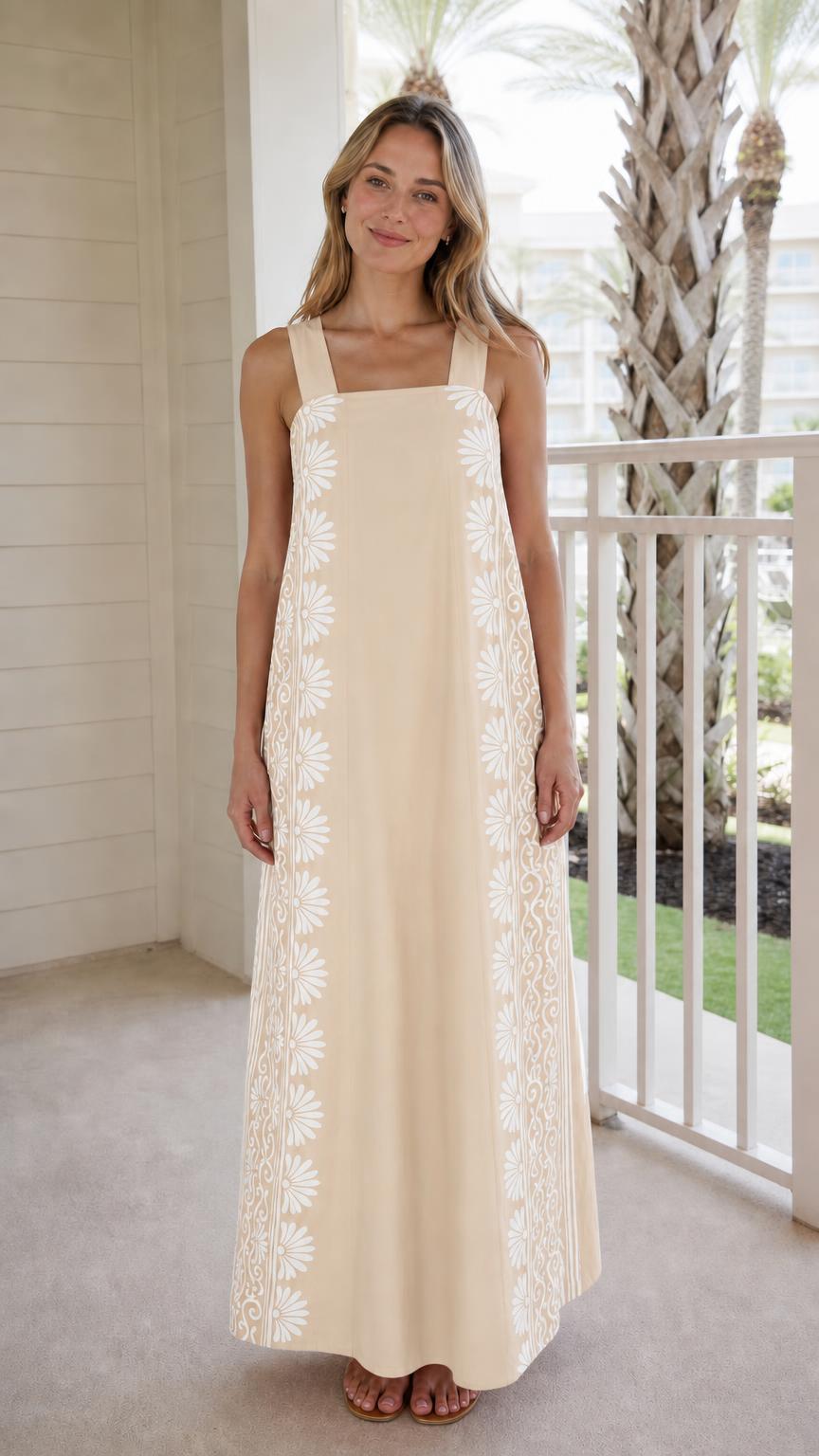 Woman wearing beige maxi dress with side print panels