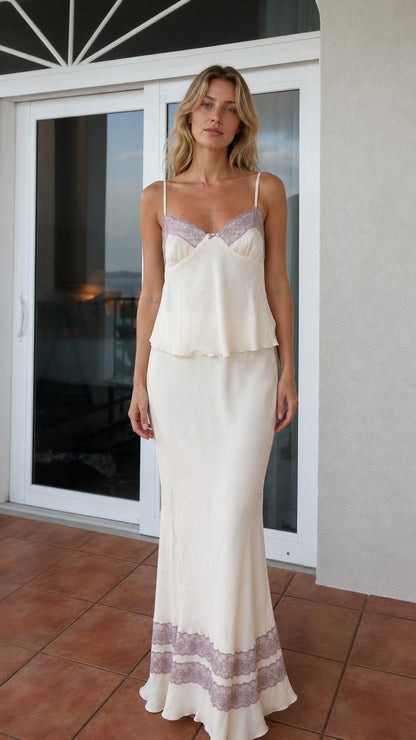 Model wearing ivory satin camisole and maxi skirt set