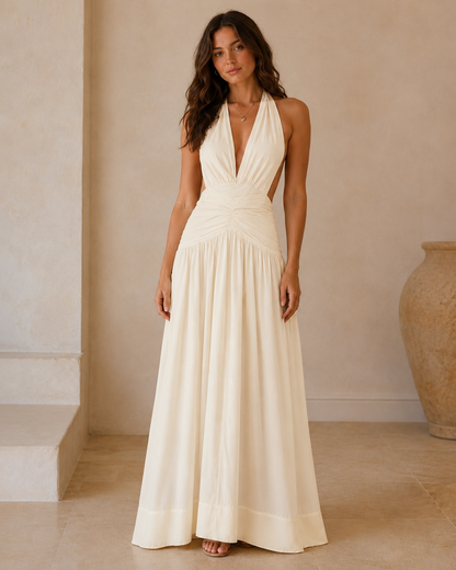 Ivory halter plunge maxi dress with ruched waist and flowing skirt front view