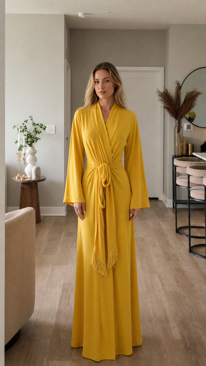 Front view of model wearing yellow long sleeve maxi wrap dress