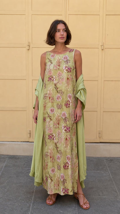Model wearing olive floral print sleeveless maxi dress with matching wrap from the front