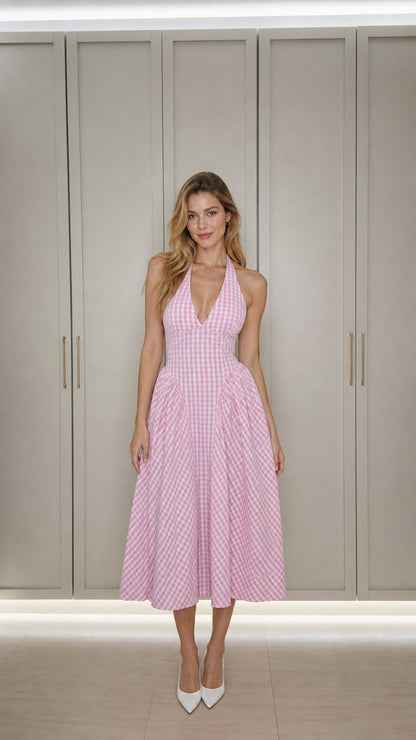Front view of model wearing pink gingham halter midi dress