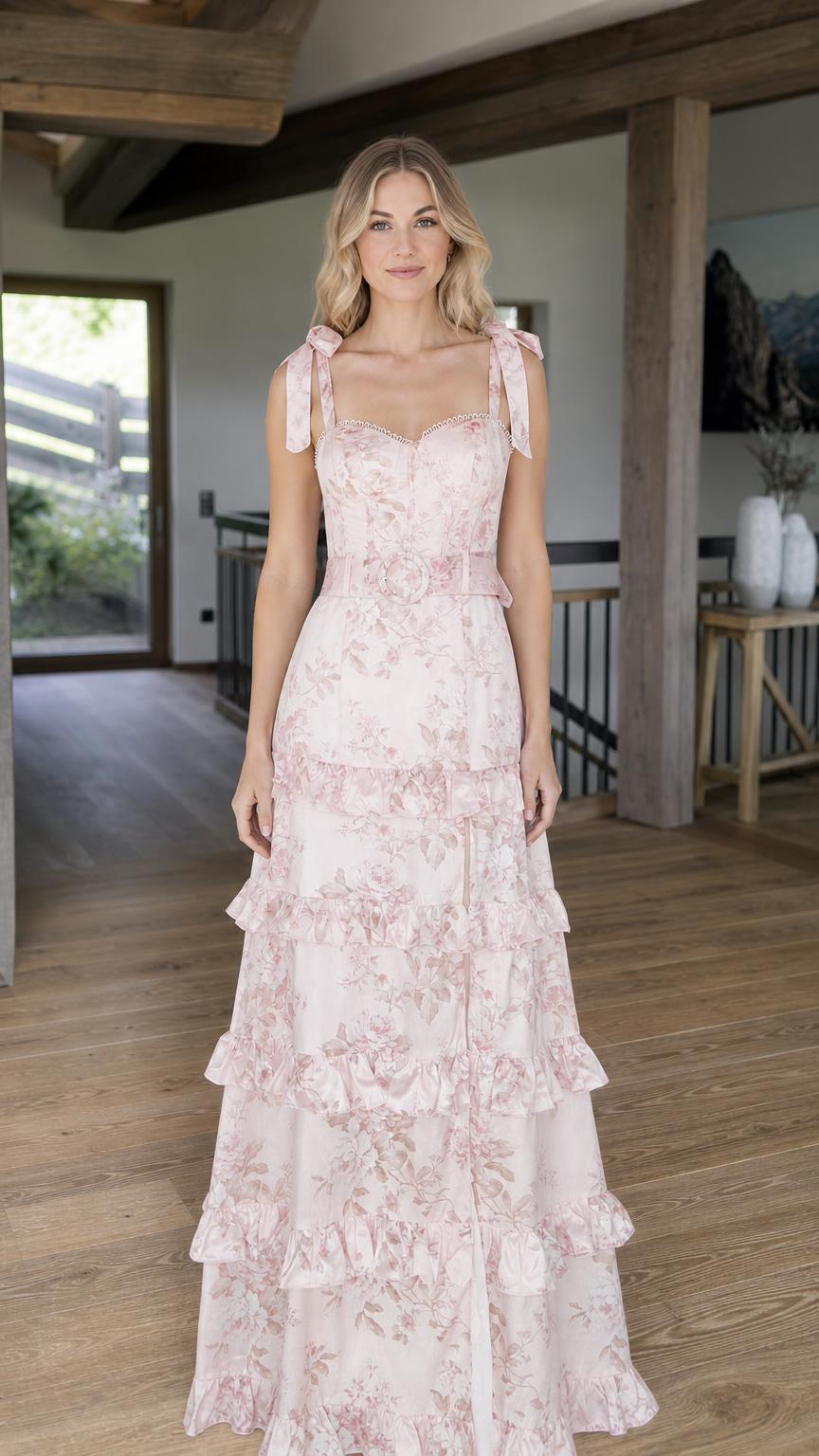 Front view of model wearing pink floral tiered maxi dress