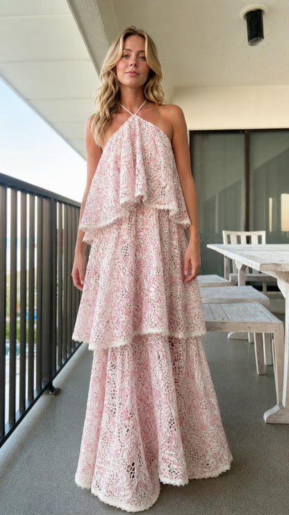 Front view of model wearing pink tiered halter lace maxi dress