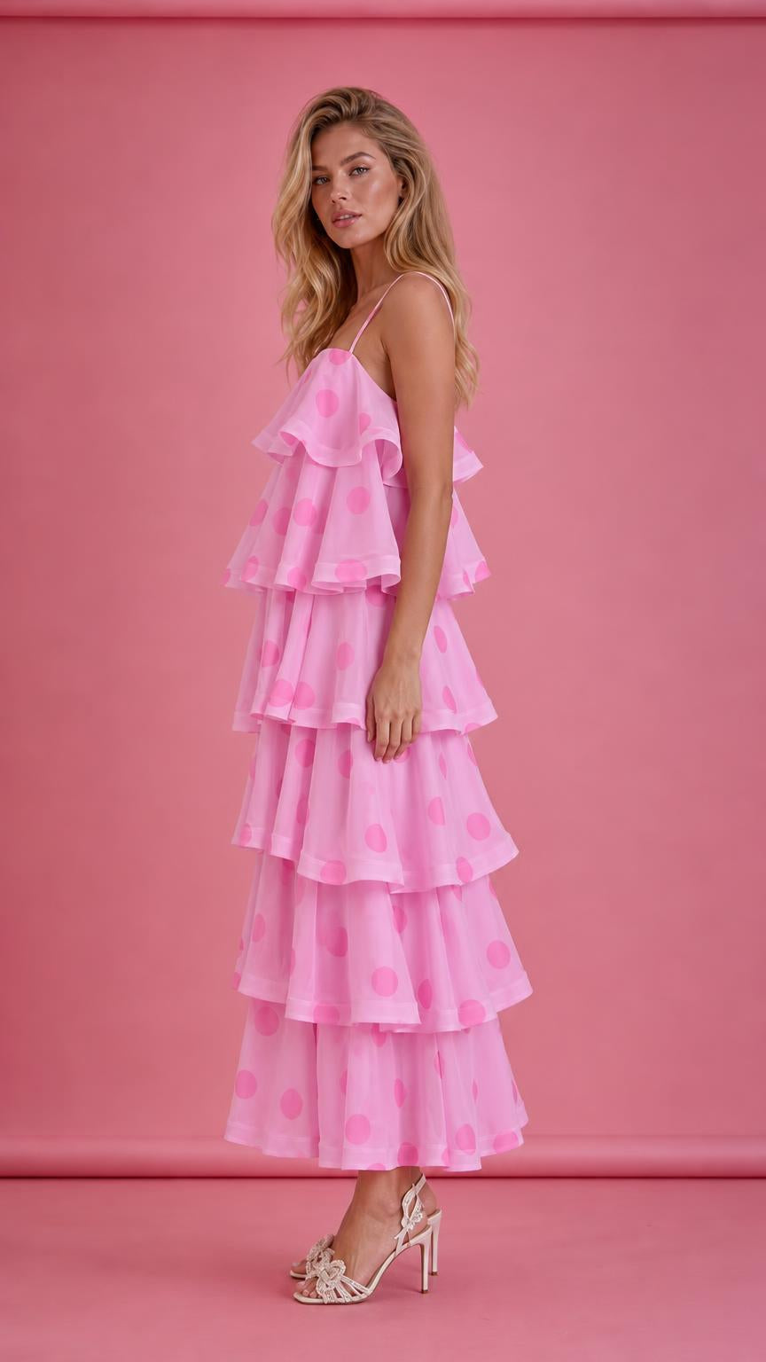 Side view of pink polka dot tiered ruffle midi dress