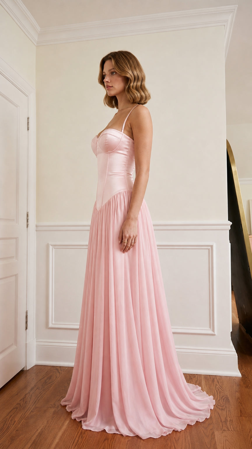 Side profile of pink satin corset maxi dress
