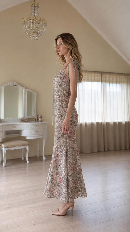 Side profile view of champagne floral sequin maxi dress