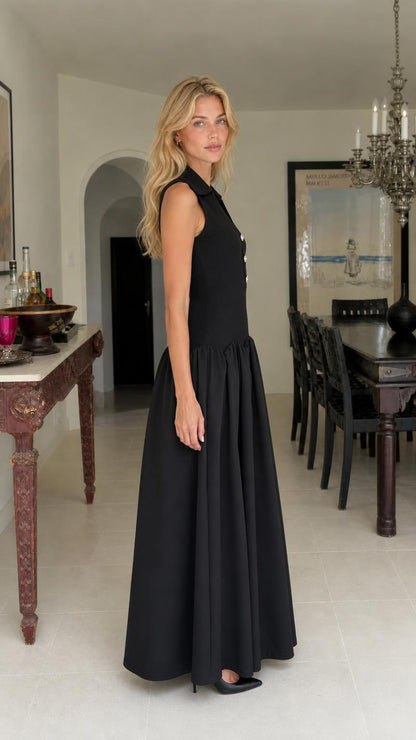 Side profile of woman in black maxi dress