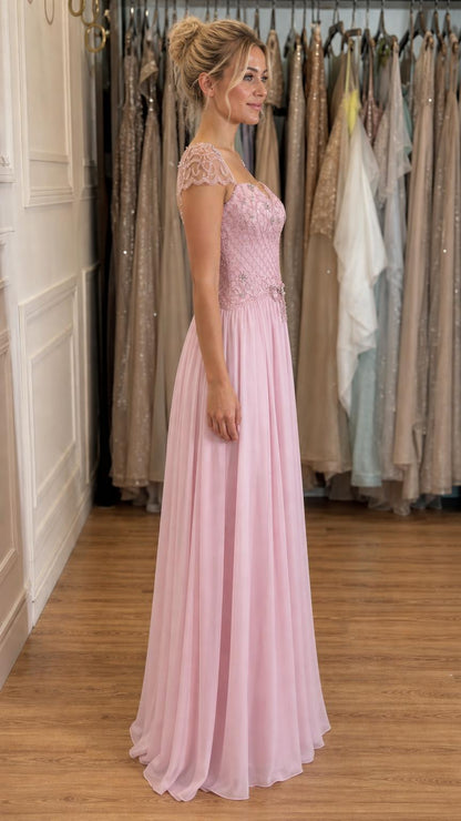 Side profile view of pink evening gown