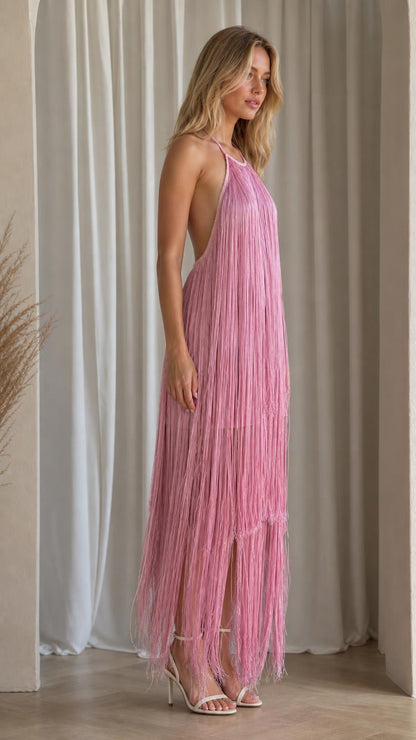 Side profile of model in pink fringe dress
