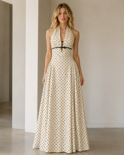Front view of cream polka dot halter maxi dress with contrast trim