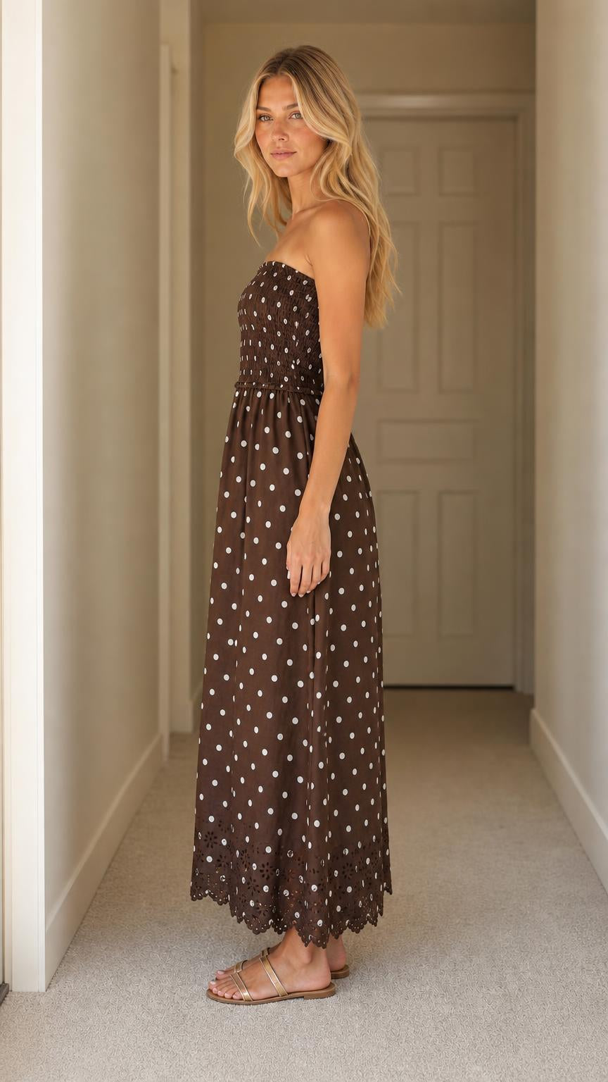 Side profile of woman wearing brown polka dot maxi dress