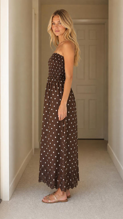 Side profile of woman wearing brown polka dot maxi dress