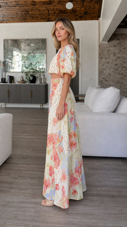 Side profile of model in multi-color floral two-piece set