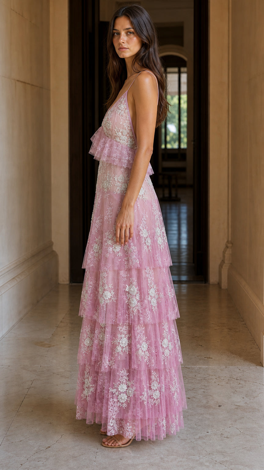 Side profile view of pink tiered maxi dress
