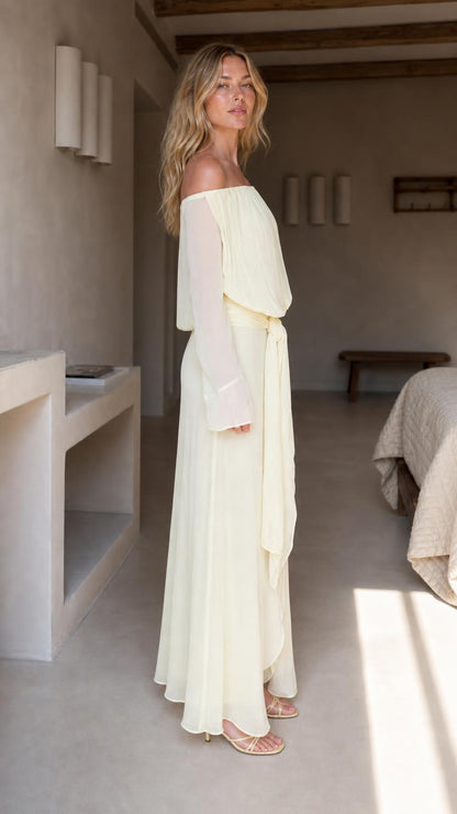 Side profile of yellow chiffon maxi dress