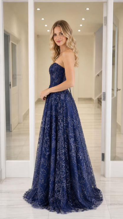 Side profile view of the navy blue strapless gown