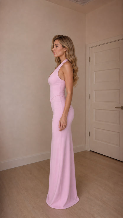 Side profile view of model in pink maxi dress