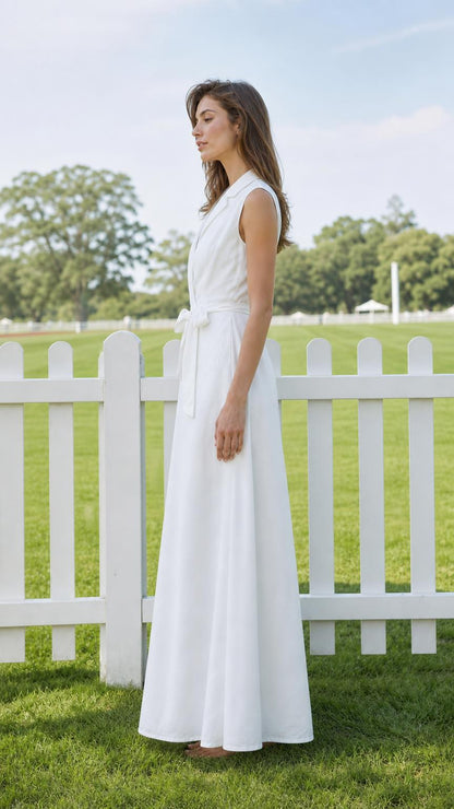Side profile of model in white belted maxi dress