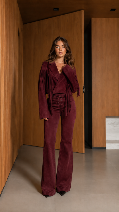 Full-length front view of burgundy fringe jacket and flared pants two-piece set