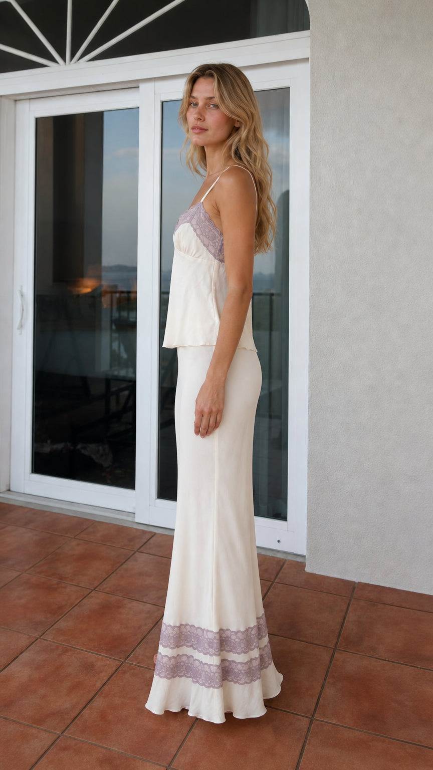 Side profile view of ivory satin two-piece set