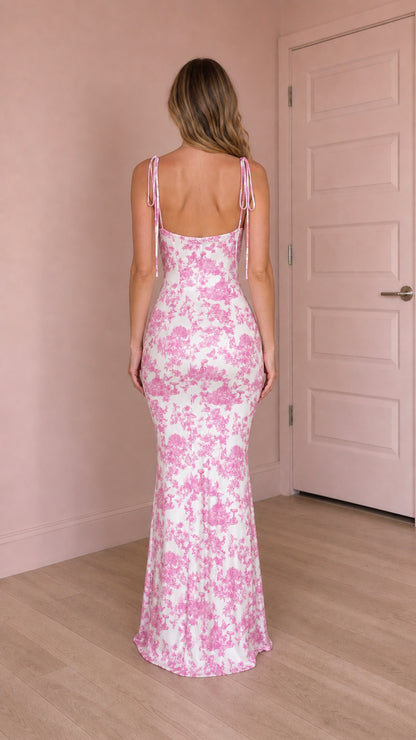 Back view of pink floral maxi dress showing tie straps