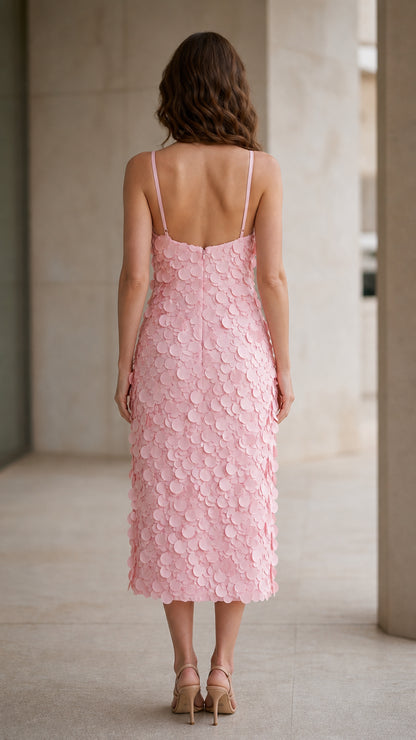 Back view of model in pink spaghetti strap midi dress
