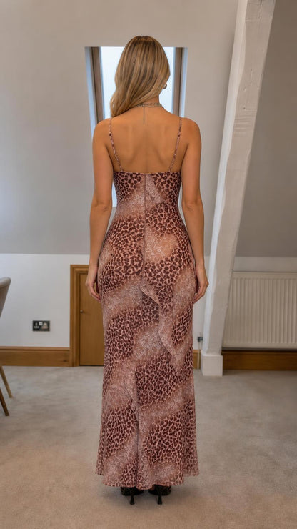 Back view of woman wearing brown leopard print slip dress