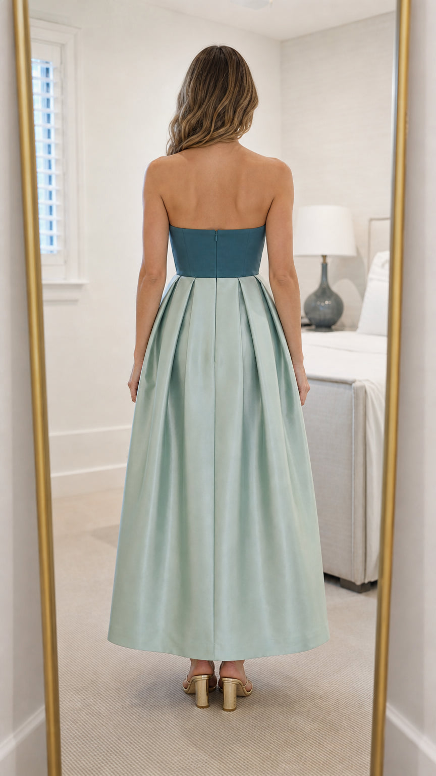 Back view of sage green strapless maxi dress