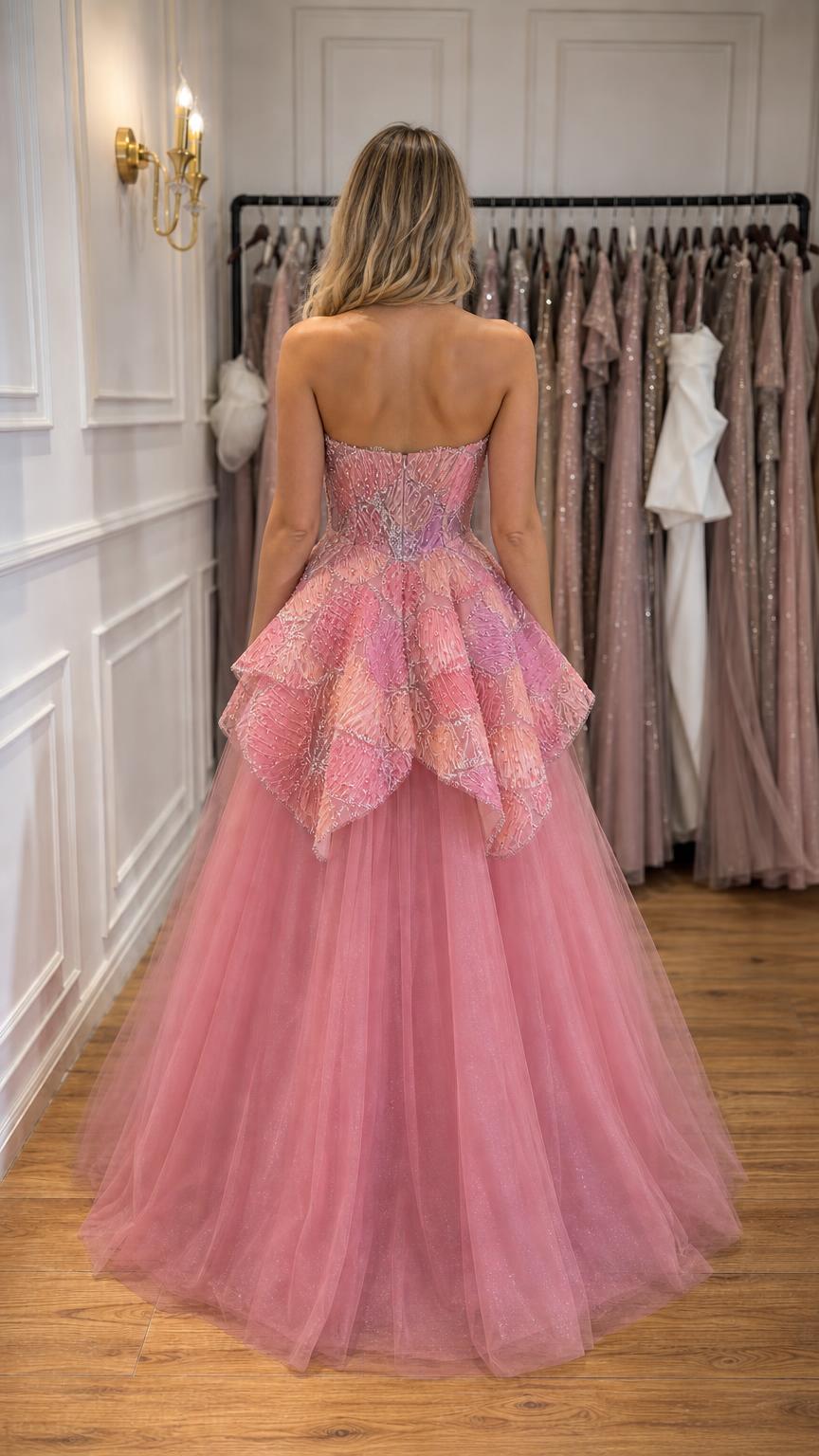 Back view of woman wearing pink strapless beaded tulle ball gown