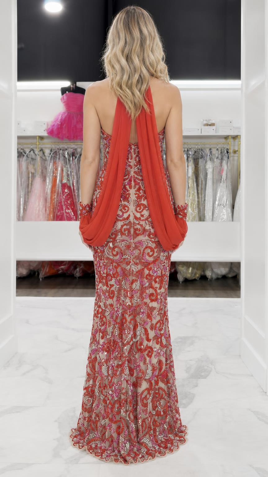 Back view showing draped detail on red evening gown
