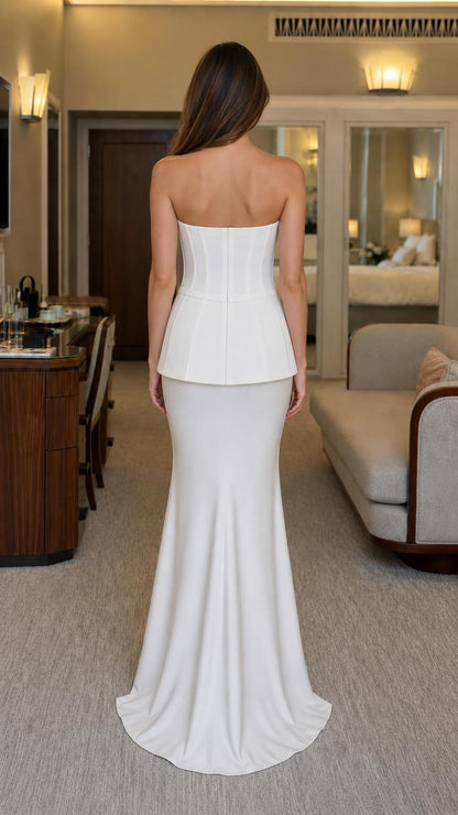 Back view of white strapless evening gown with slight train