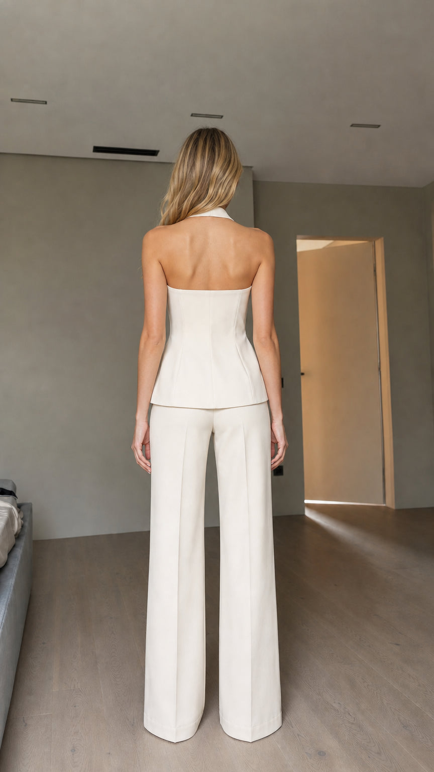 Model wearing white pants set back view