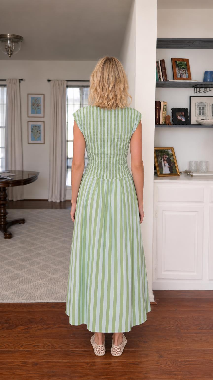 Back view of woman wearing green striped smocked maxi dress