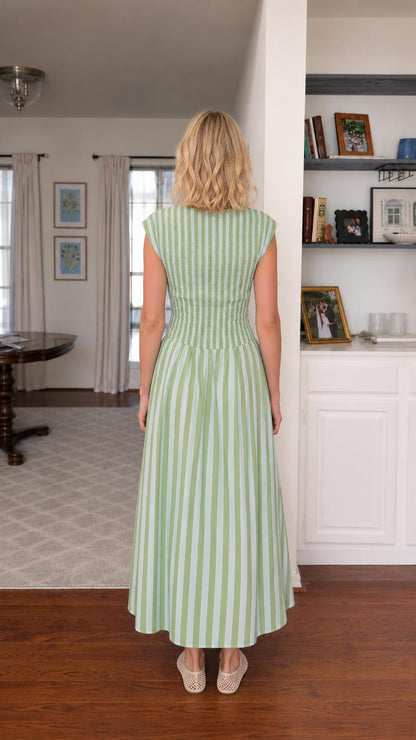 Back view of woman wearing green striped smocked maxi dress