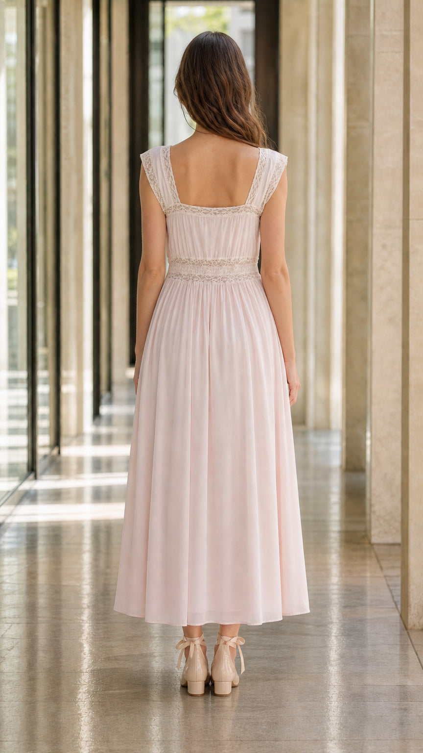 Back view of model in pink midi dress