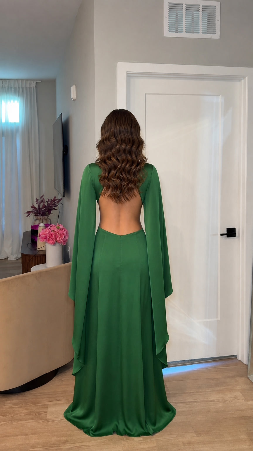Back view of model showing open back design of green maxi dress