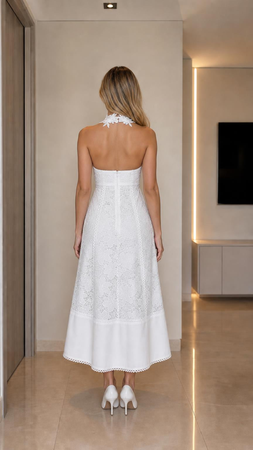 Back view showcasing open back design of white lace dress