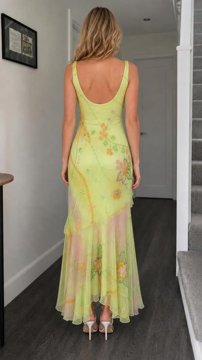 Back view of yellow floral beaded mesh maxi dress showing scoop back
