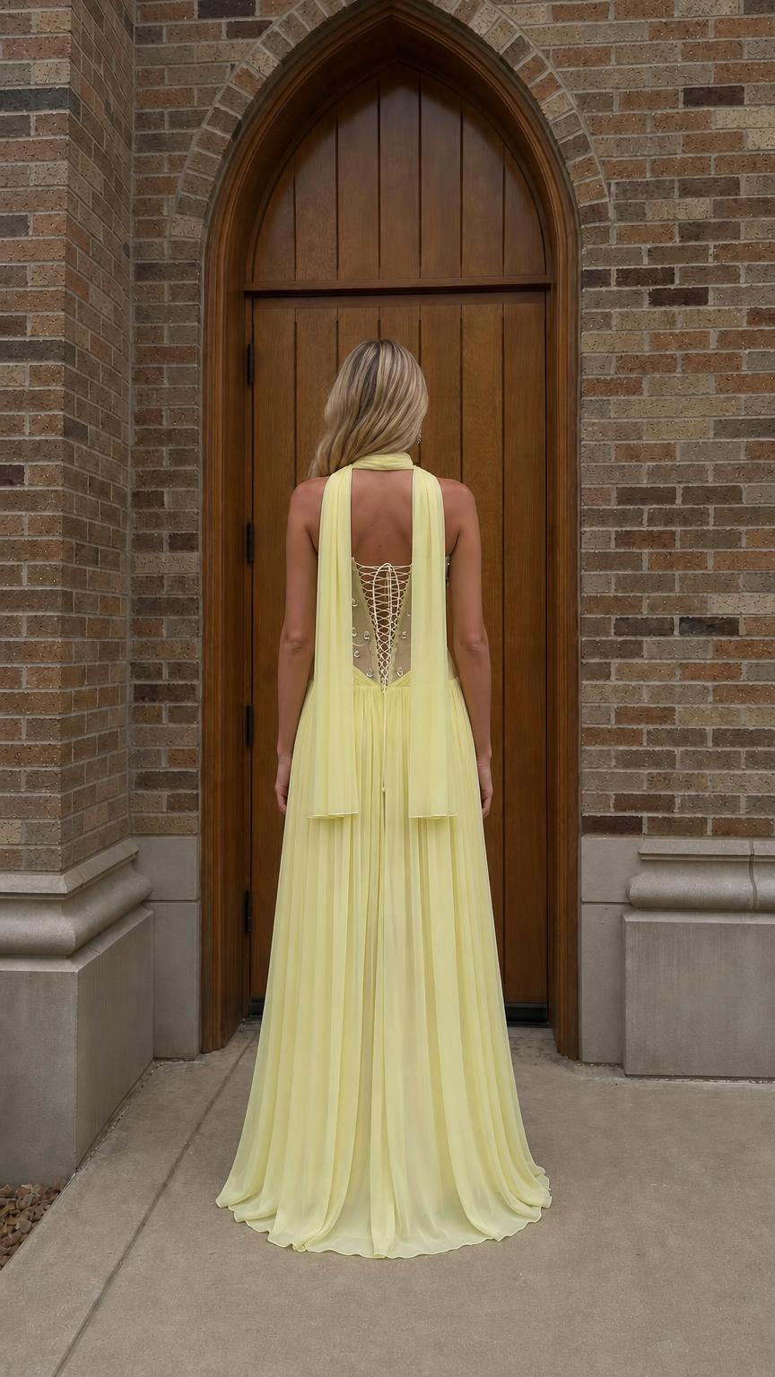 Back view of yellow formal dress showing laced corset detail