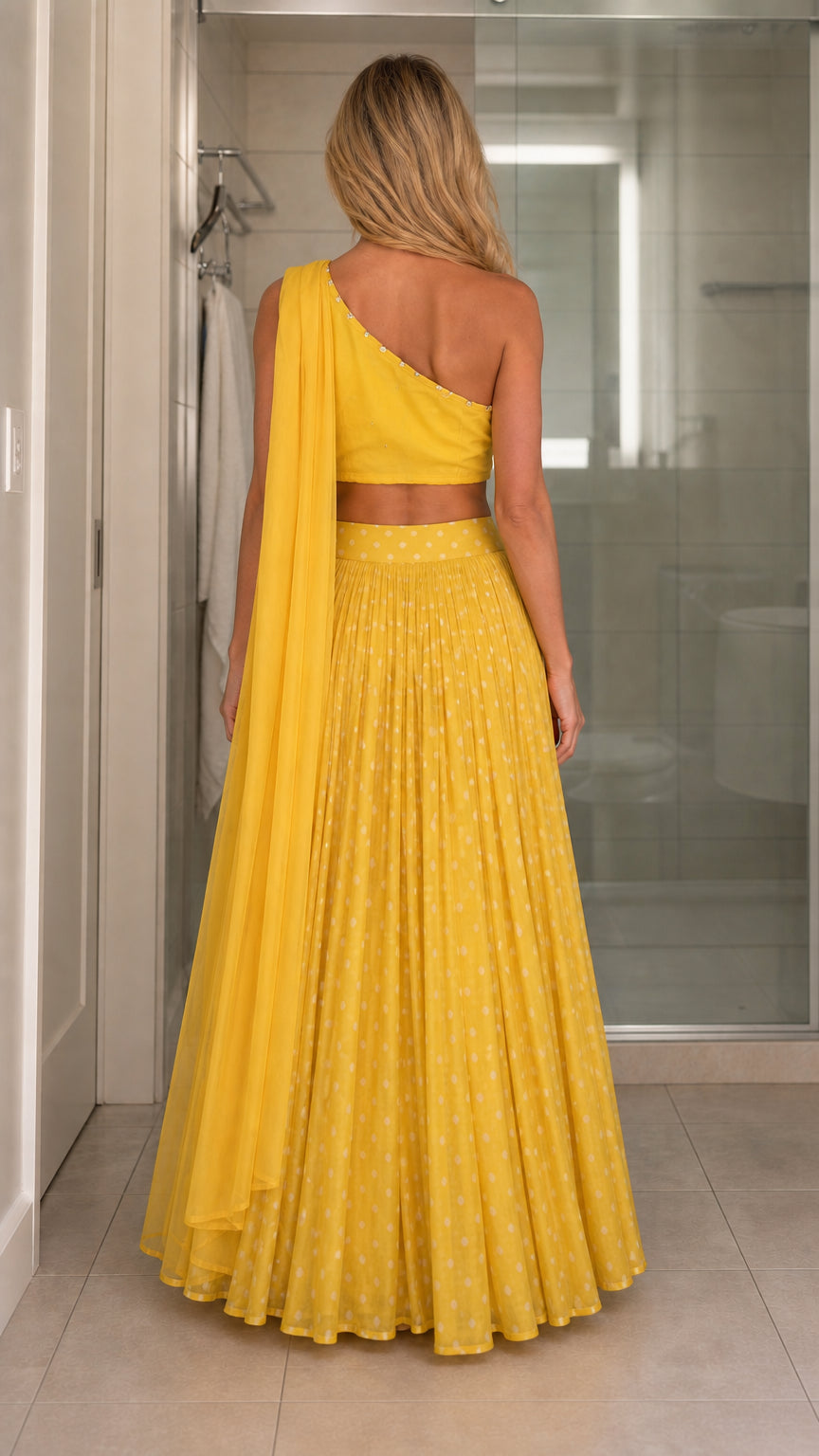 Back view of model in yellow maxi skirt and crop top set