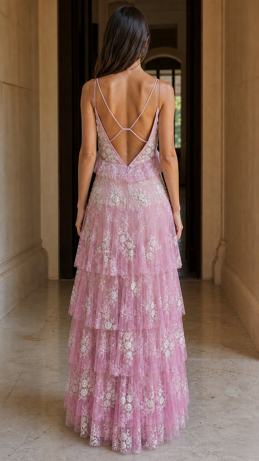 Back view showing cross-straps on pink maxi dress