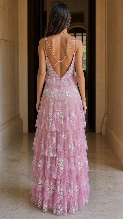 Back view showing cross-straps on pink maxi dress