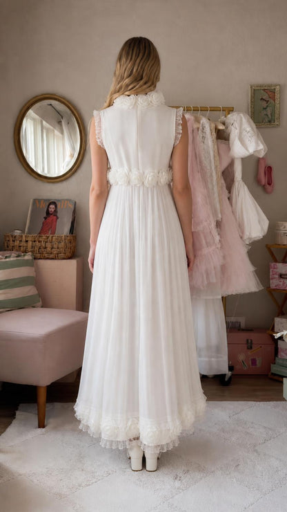 Back view of white sleeveless long dress