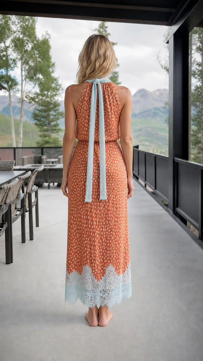 Back view showing halter neck tie detail on rust orange dress