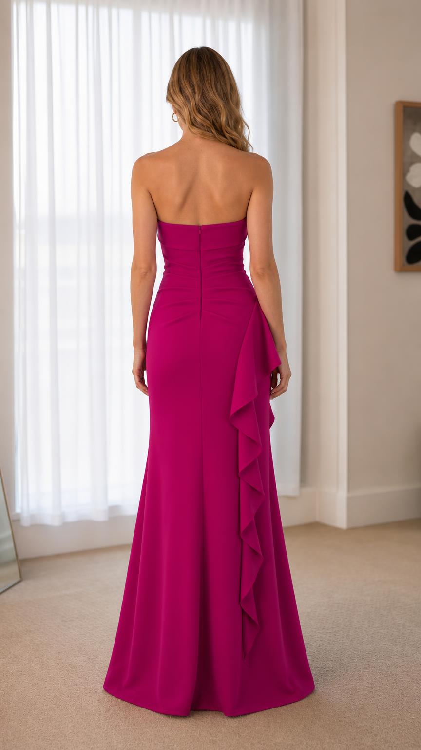 Back view showing clean strapless design and flow of fuchsia gown