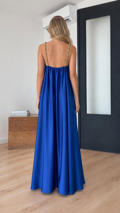 Back view of model showcasing beaded straps on royal blue dress