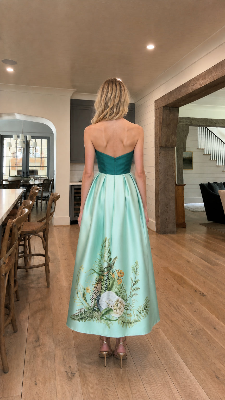 Back view of model in teal and mint strapless evening gown