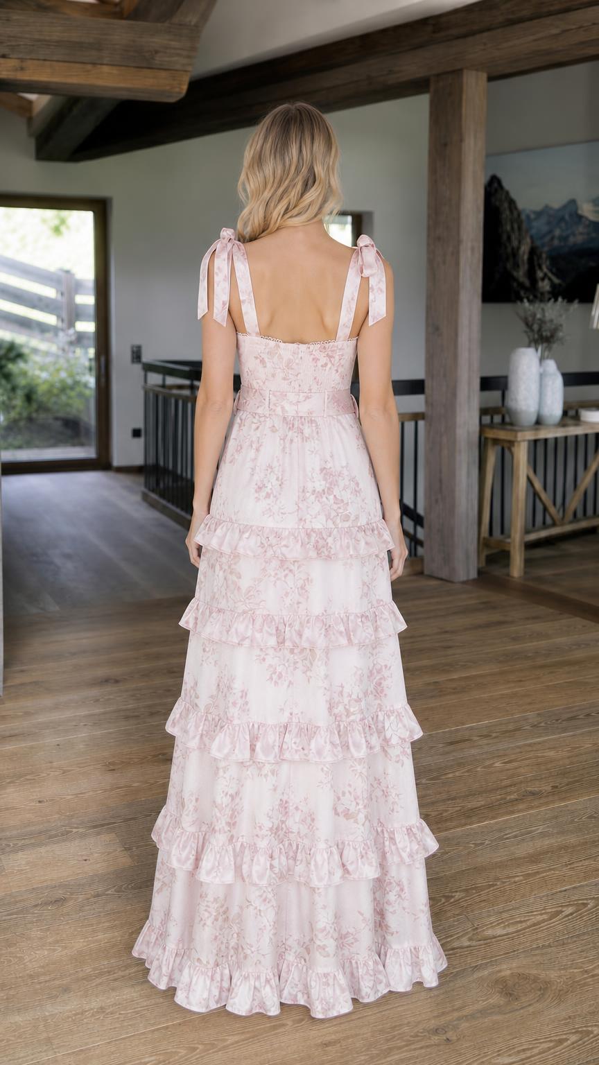 Back view of pink floral tiered maxi dress showing self-tie straps